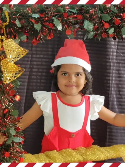 A festive portrait in our Christmas photo frame, decorated with bells and tinsel.
