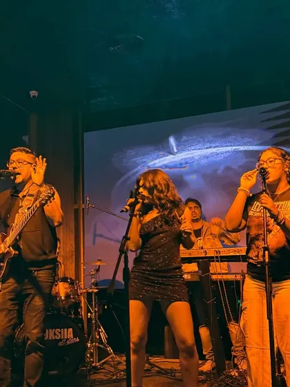 Here I am with the Moksha All Stars, my full-power party band. We love getting on stage together and bringing that big sound for weddings and corporate events, playing everything from rock to pop.