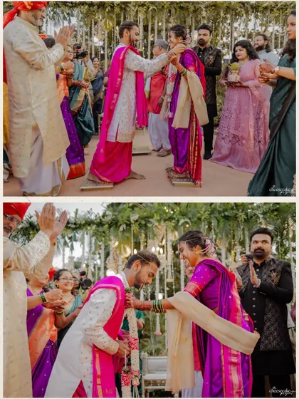 The Varmala exchange during a vibrant Maharashtrian wedding.