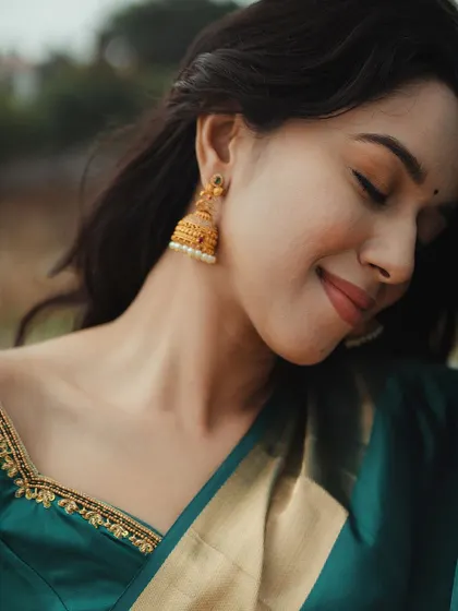 A serene portrait of Mirnalini. The soft makeup and her gentle expression create a timeless and beautiful image.