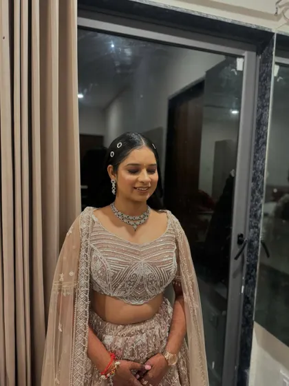 This bride opted for a chic and modern look for her sangeet or engagement, with a sleek hairstyle and glowing makeup.