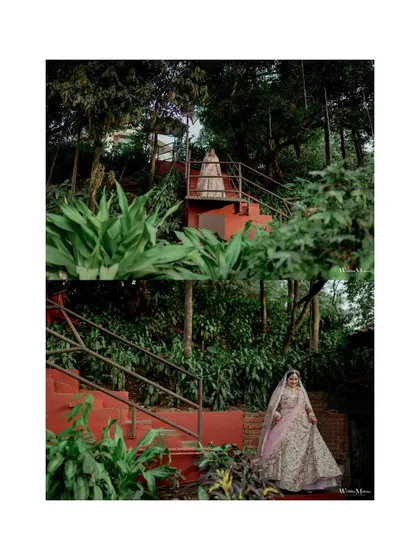A beautiful portrait of the bride on a staircase surrounded by lush greenery, creating a fairytale-like image.