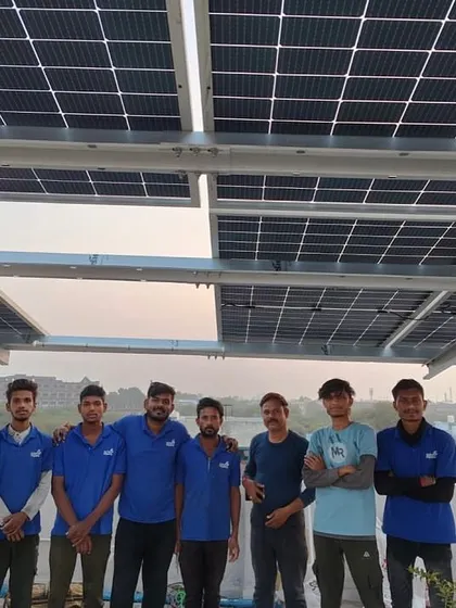 Our crew stands with a customer under his new solar panel array, a symbol of his commitment to a sustainable future.