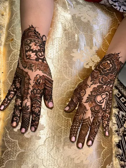 This design shows how I can create different but complementary patterns on each hand, one with a geometric focus and the other with a heart initial.