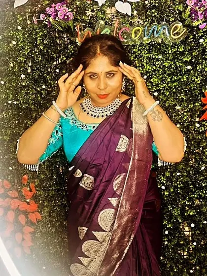 A fun pose against a decorated backdrop, showing off the complete look.