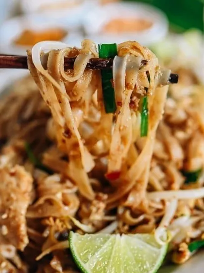 A tempting close-up of Pad Thai noodles, showcasing the fresh ingredients and authentic flavors of this classic dish from our Asian Week menu.