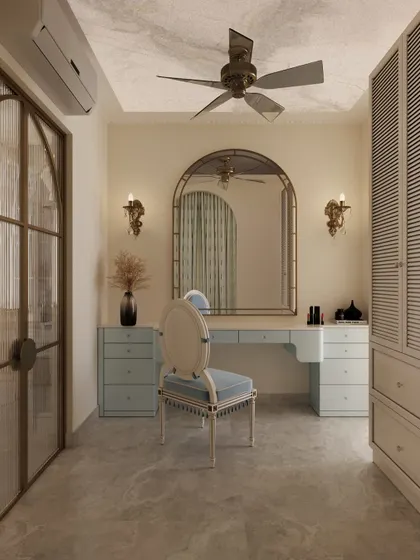 Another view of the sophisticated vanity, showcasing the fluted wardrobe doors and the elegant arched mirror that serves as the centerpiece.