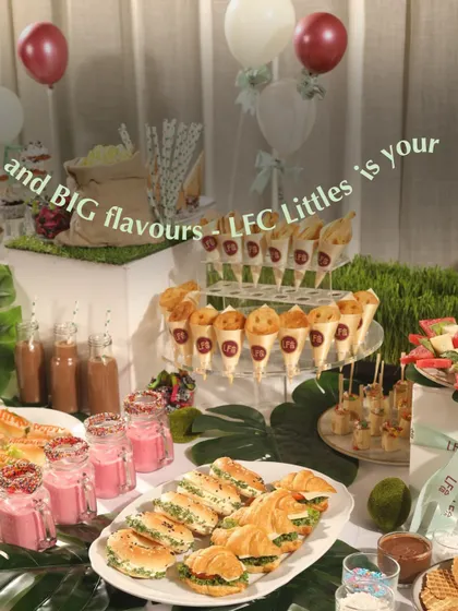 A beautiful spread for a kids' party, including mini croissants, sandwiches, and colorful smoothies. We focus on creating balanced menus that are both fun and wholesome.