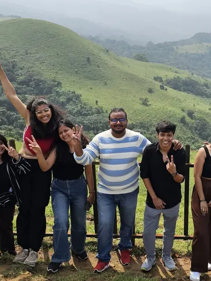 All smiles and peace signs with the stunning green hills of Coorg as our backdrop. The camaraderie and fun are just as important as the destination itself.