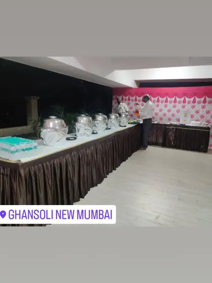 A buffet setup for a birthday party in Ghansoli, New Mumbai. The cake is placed at the end of the buffet line.