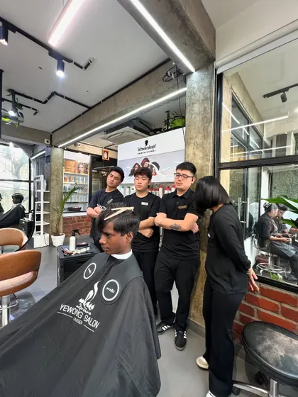 Teamwork is everything. Here, my stylists are observing a haircut, a great example of how we learn from each other to constantly improve our skills.