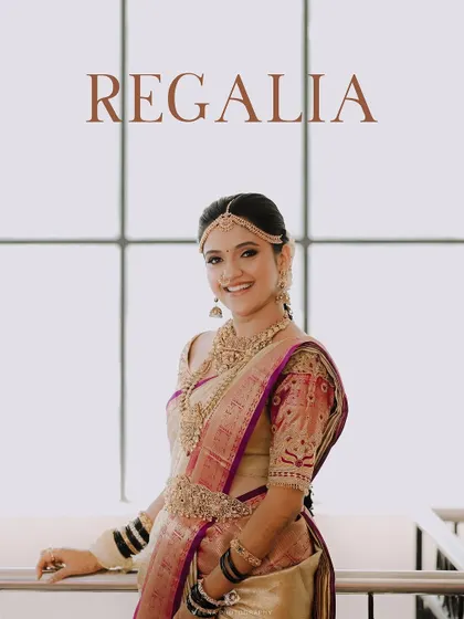 A portrait of a bride in her wedding regalia, showcasing the expertly draped silk saree that enhances her figure. The combination of hair and saree styling creates a regal look.