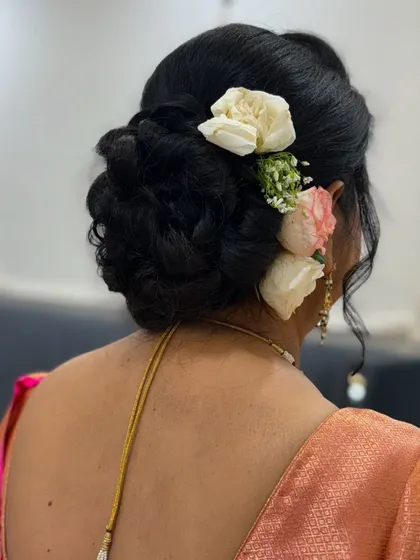 A back view of the floral bun, showcasing its neatness and elegance.