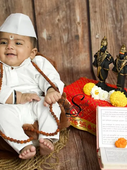 This little boy's happy expression is infectious. The entire Varkari setup is designed to be both culturally respectful and comfortable for the baby.