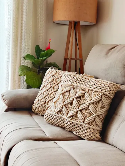 The natural cream color of these cushion covers makes them a versatile choice for any home.
