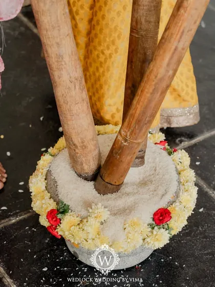 For this Haldi, we focused on a vibrant yellow theme with rustic touches. We used hanging cane baskets filled with yellow flowers, lush greens, and traditional brass urlis to create a warm and sunny celebration.
