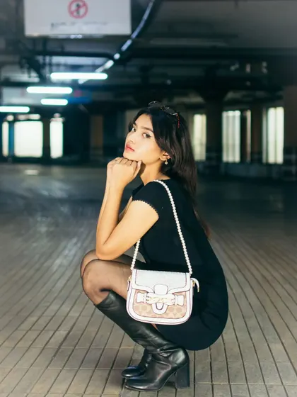 A portrait from a shoot in an underground parking lot, using the cool, industrial lighting to our advantage. The setting provides a unique, edgy backdrop for a modern fashion portrait.