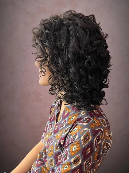 The layers in this cut allow each curl to sit perfectly without being weighed down.