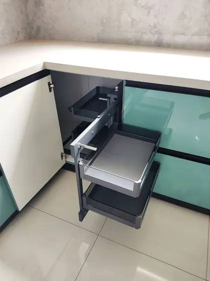 No more hard-to-reach corners. This video showcases a magic corner unit in action, a pull-out system that makes accessing items in the deepest corner of your kitchen cabinets effortless and efficient.