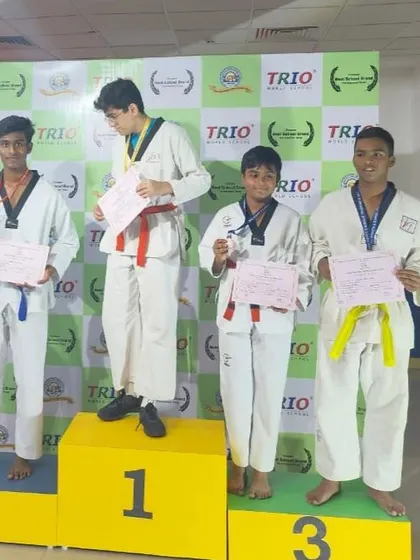 The podium finish for our students at the CISCE Regional Sports and Games. This image shows Karthik (Silver) and other winners receiving their medals and certificates.