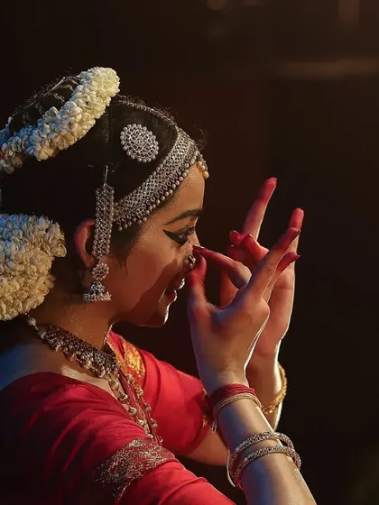 A close up detail showing the 'Katakamukha' mudra, often used to depict holding flowers or speaking. This moment from "Venkatesha Shreesha" is filled with delicate expression.