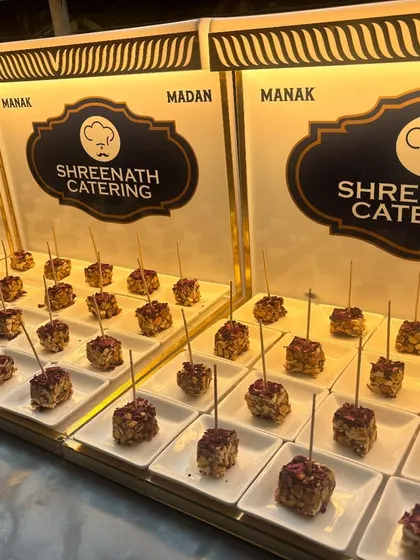 An elegant display of our signature appetizers or sweets on branded counters, ready to be served to guests.