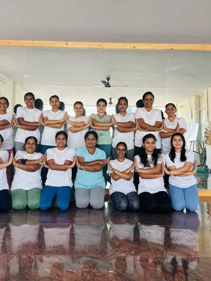 The full group of participants, united in their achievement. This is what our yoga community is all about.