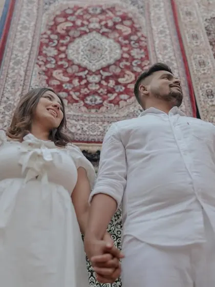 A creative low-angle shot of the couple, making the carpet-filled room look even more grand.