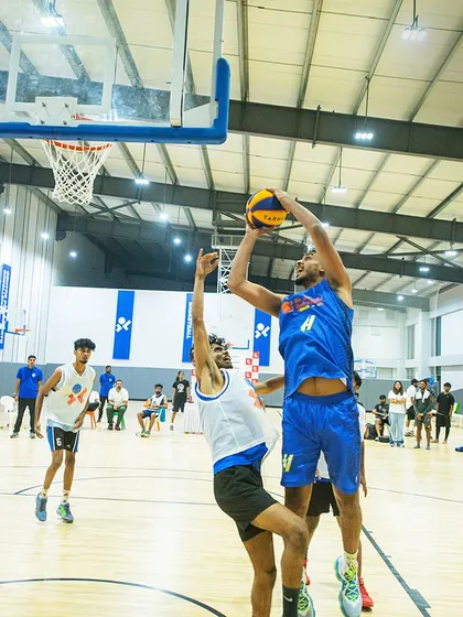 A player goes up for a tough, contested shot. Engaging in tournaments teaches athletes to perform under pressure.