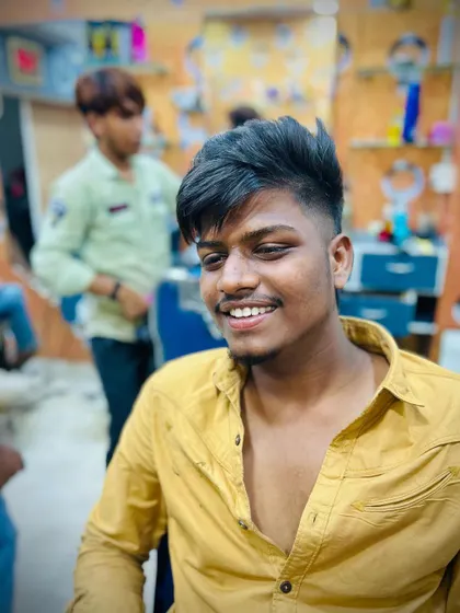 The client is happy with his new textured mullet. This front view shows how the style frames the face while keeping the trendy length at the back.