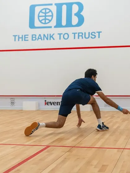 Ramit Tandon lunging for a difficult shot, showcasing the athleticism and determination we instill in our professional players.