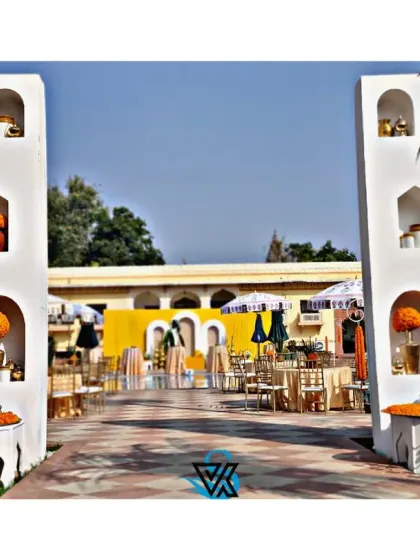 A Haldi ceremony is all about vibrant joy. We built these grand entrance pillars with traditional arched niches, filled with marigolds and brass decor, to welcome guests into a sun-drenched celebration full of color and energy.