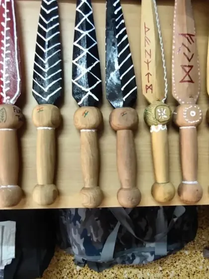 A close-up of the hand-painted wooden training blades we prepared for the International Blade Fight Federation (IBFF) introduction at the UWMAF World Cup.