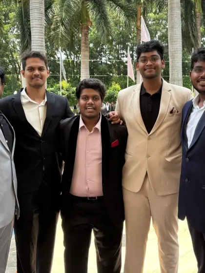 Another shot of the graduates. You can see different suit styles here, from a classic black suit to a modern beige one.