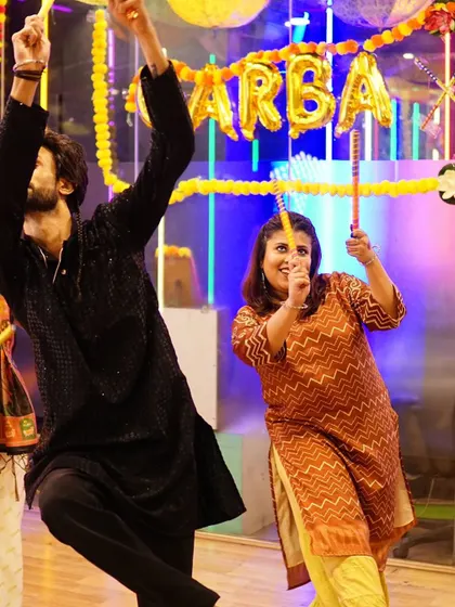 Capturing the high-energy finale of a Garba dance. Our routines are designed to build up excitement and end with a memorable flourish.