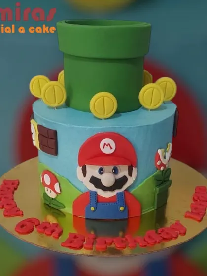 It's-a me, Mario! This Super Mario cake brings the Mushroom Kingdom to your party. It features Mario, a classic green pipe, and gold coins on a two-tier design for a 6th birthday adventure.