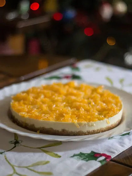 This orange baked yogurt cake tastes so fresh and light, especially with the Christmas lights in the background. It's the perfect end to a heavy meal and is much lighter on the tummy than a traditional cheesecake.