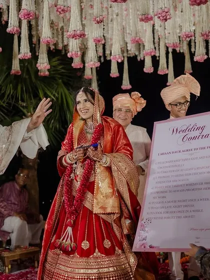The bride's joyful reaction as the groom reads out the lighthearted wedding contract.