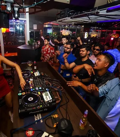 A view from the side of the console, with the crowd fully engaged and dancing. These are the nights that never die.