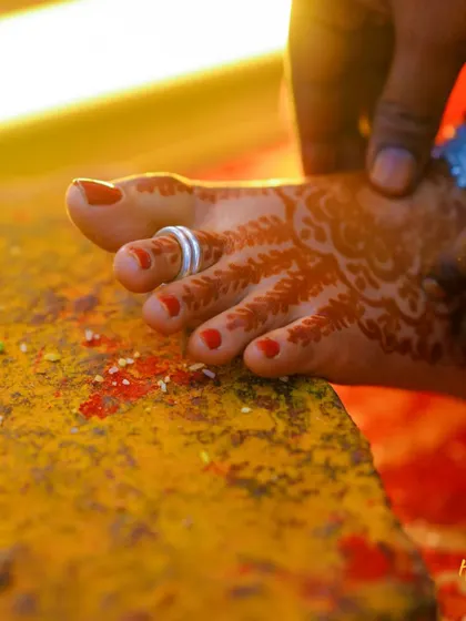 A close-up of the toe ring ritual, a significant moment in many Indian weddings. I focus on capturing these small but meaningful details.
