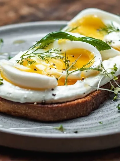 Soft-boiled eggs on a bed of our fresh ricotta, served on toasted sourdough and garnished with dill. A light yet satisfying breakfast option.