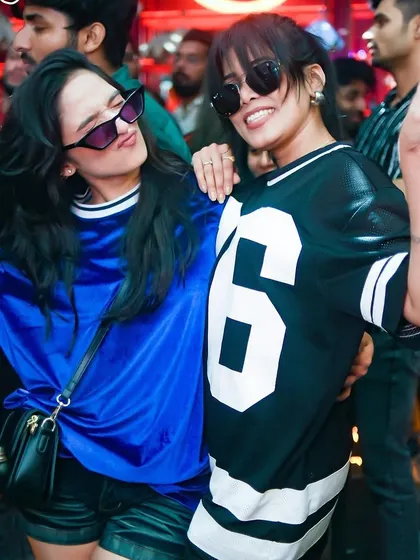 Peace signs and good vibes from these two partygoers at The Fixx Bar.