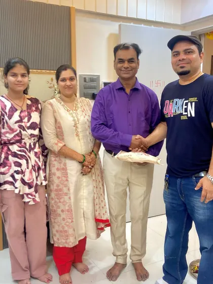 Posing with the Navle family after their successful Griha Pravesh. Building relationships with my clients is as important as building their homes.