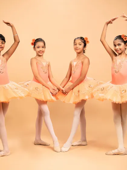 Dressed as blooming flowers, these dancers are ready for 'The Waltz of the Flowers' from The Nutcracker. Their poses capture the delicate beauty of nature's cycle, from bud to full bloom.