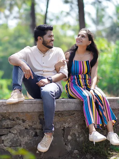 A playful interaction between the couple. These little moments show their unique personality and the fun they have together.