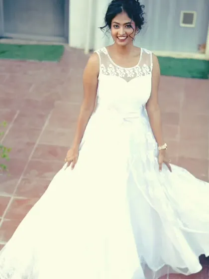 The flowing skirt of this white gown looks beautiful in motion, as seen in this shot from a staircase.