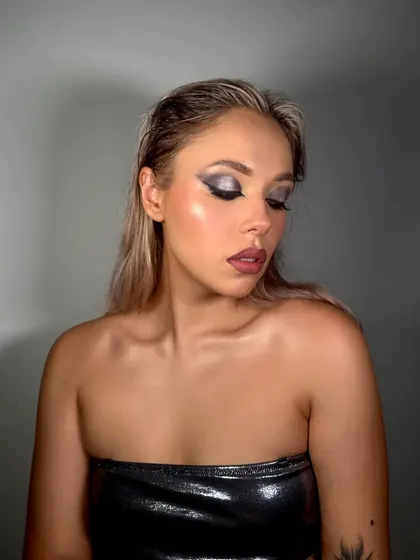 A close-up of a metallic, futuristic smokey eye. The glossy finish on the lid adds an extra layer of dimension, making it perfect for an editorial or avant-garde project.