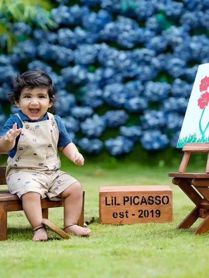 A happy little artist waving hello! The 'Lil Picasso' theme brings out the most joyful and creative expressions.