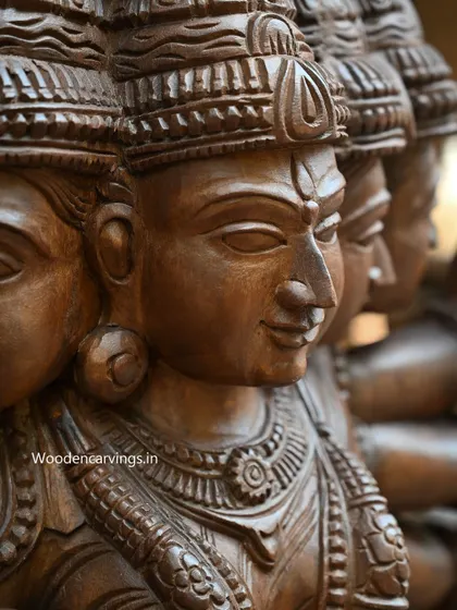 A side-view close-up of the five faces of Gayathri Devi, showing how they are integrated into a single form.