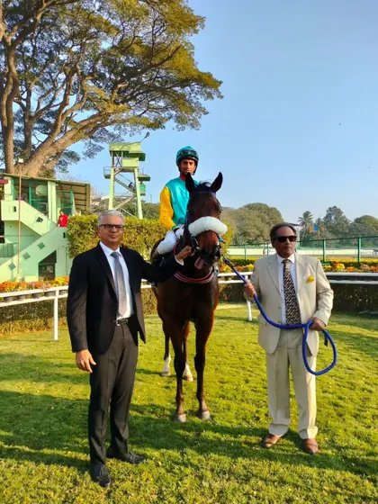 Exceed, with jockey P. Trevor, after winning the memorial million.